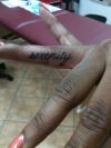 finger text tattoo